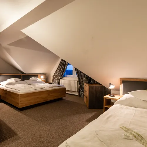 Detail of an attic room with exposed beams