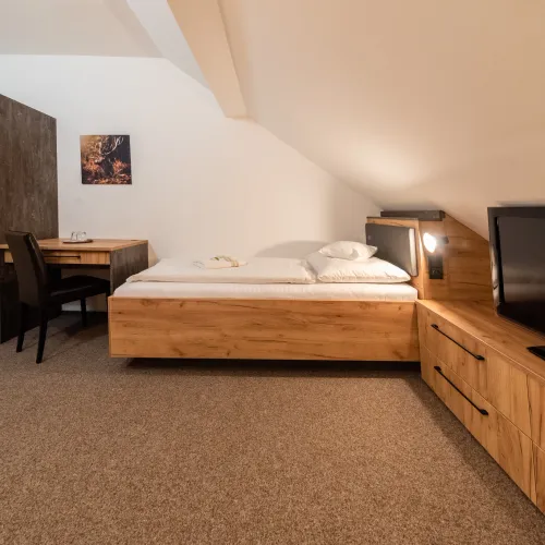 Attic room with a single bed